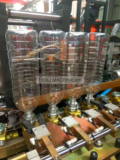 Dernière vente chaude entièrement automatique 4 cavités bouteille de jus de 2 litres machine de moulage par soufflage PET